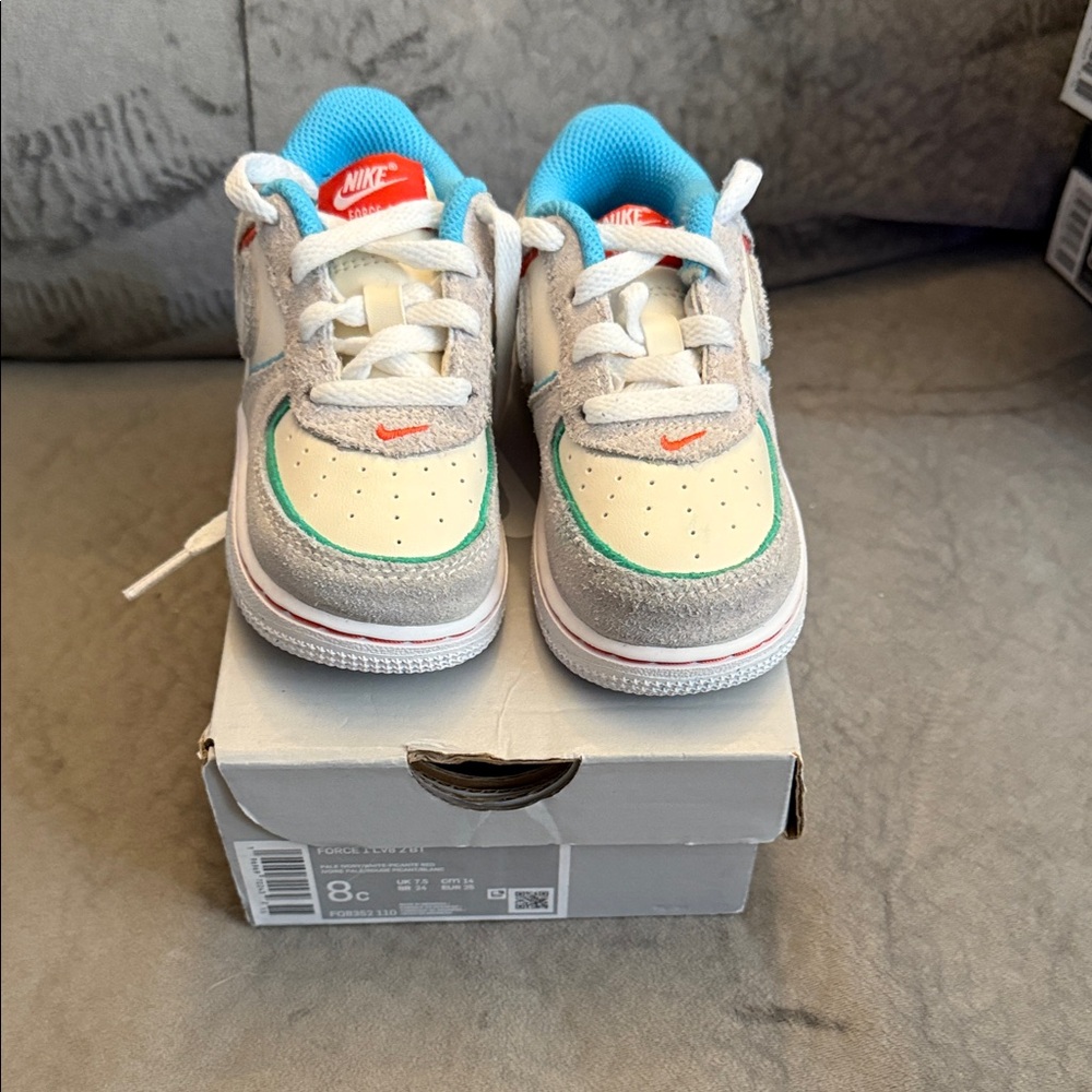 Only worn once. Airforce 1’s Nike Kids' Cream and Blue Sneakers